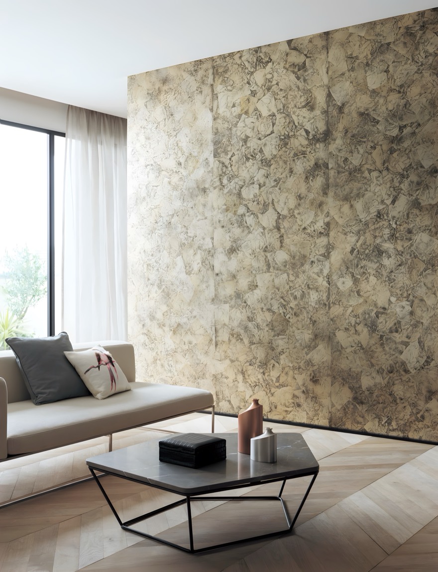 A living-room wall of flaked leaf behind a sofa