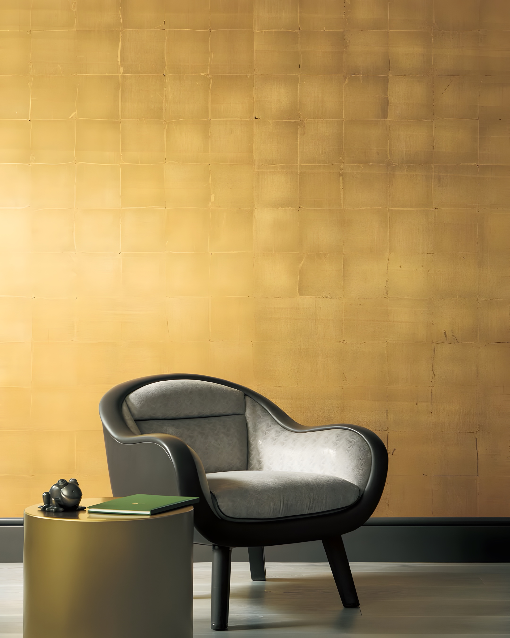 A gold leaf wall, laid square by square, with an armchair before it